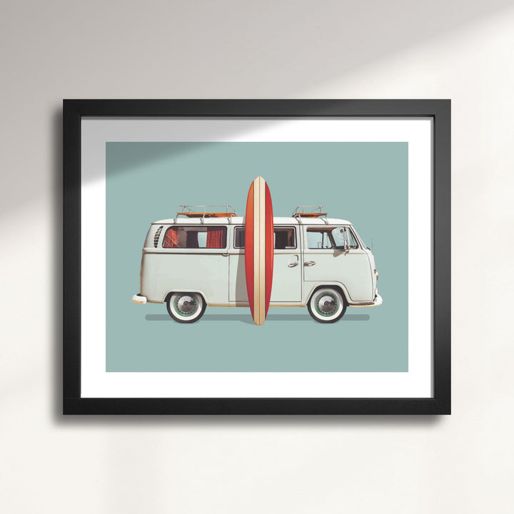 Framed artwork of a vintage 1967 VW Camper Bus with a surfboard on a light blue background