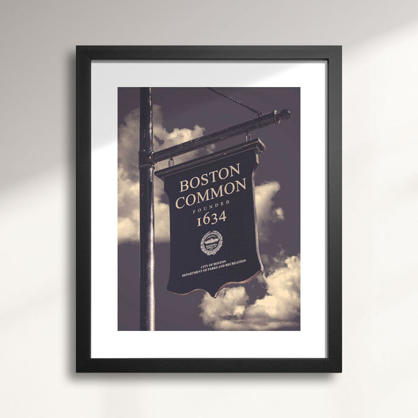 Framed print of a Boston Common sign with a cloudy sky background