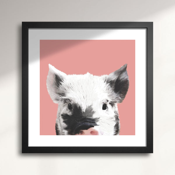 Framed artwork of a pig's face on a pink background titled 'Maple Bacon' Piglet