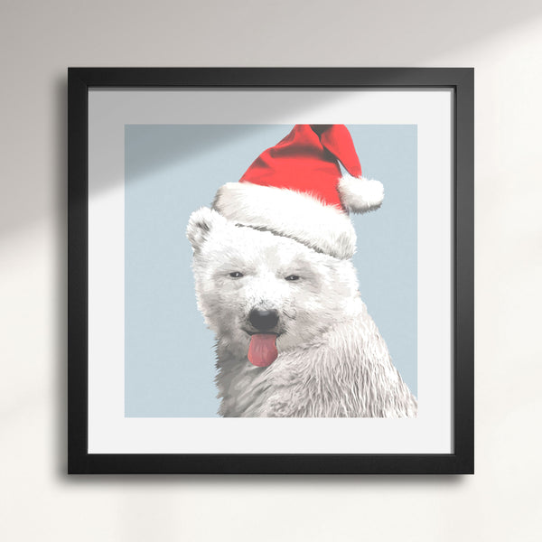 Framed artwork of a polar bear wearing a Santa hat against a light blue background titled North Pole-r Bear