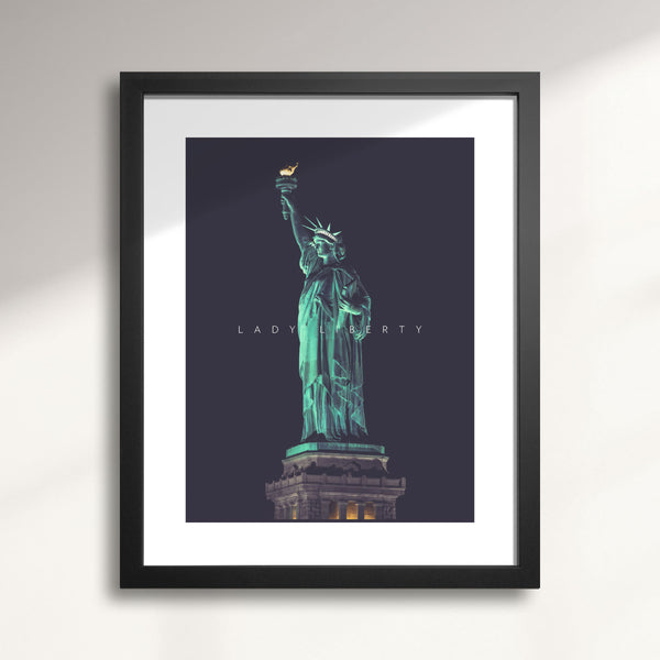 Framed artwork of the Statue of Liberty on a dark background titled Lady Liberty at Night