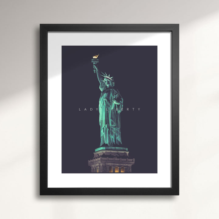 Framed artwork of the Statue of Liberty on a dark background titled Lady Liberty at Night